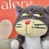 gatito enojon peluche