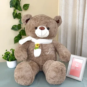 Peluche de oso grande color marrón con bufanda