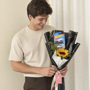 Ramo con girasol y auto Hot Wheels en papel negro para regalo a hombre